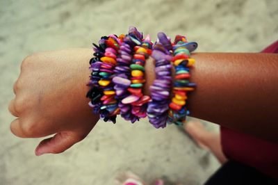 Close-up of person holding multi colored hand