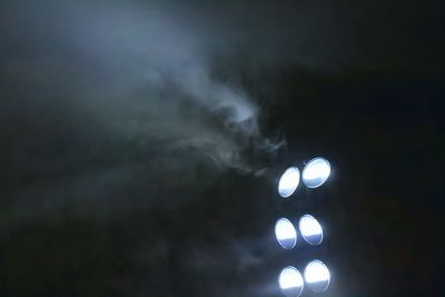 Low angle view of illuminated street light against sky at night