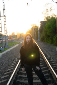 Low angle view of young woman walking on escalator