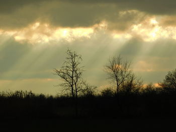 Scenic view of landscape against cloudy sky