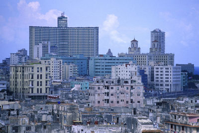 Modern buildings in city against sky