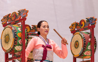 Portrait of young woman standing outdoors