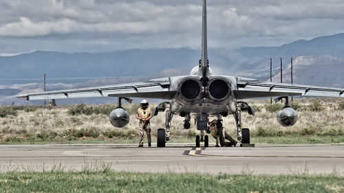 People on airport runway