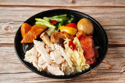 High angle view of fruit salad in bowl on table