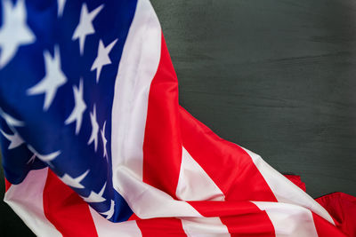 Close-up of red flag against blue sky