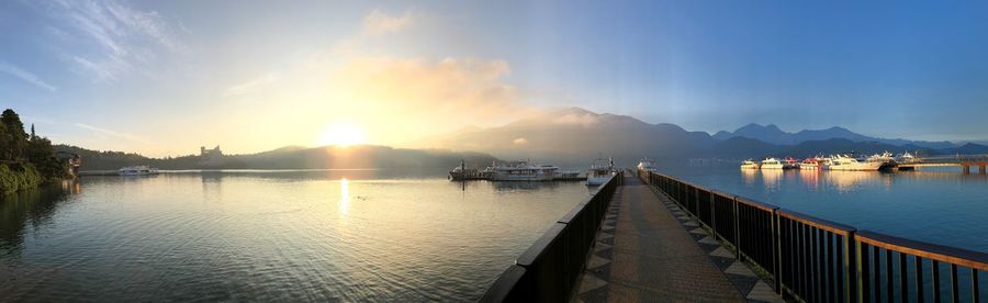 Panoramic view of lake against sky during sunset