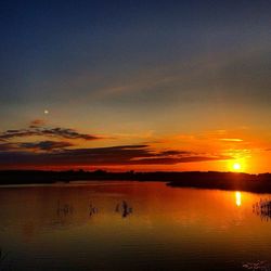 Scenic view of sunset over river