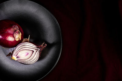 High angle view of apple on table against black background