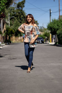 Elegant business woman enjoying walking the city after hard working day. student girl in a trendy 