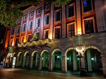 Buildings in city at night