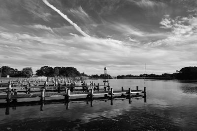 Group of people in lake against sky