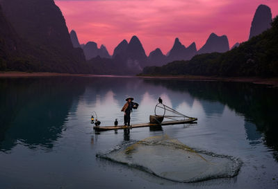 Scenic view of lake against sky during sunset