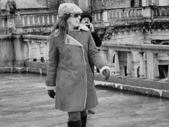 Full length of woman standing in city