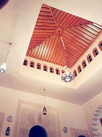 Low angle view of illuminated ceiling