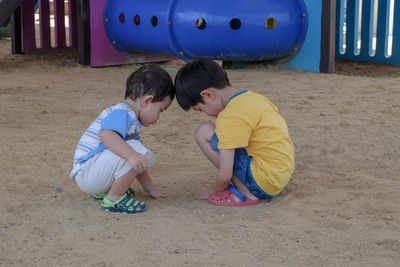 Children playing with umbrella