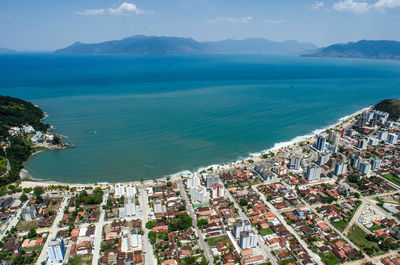 High angle view of townscape by sea