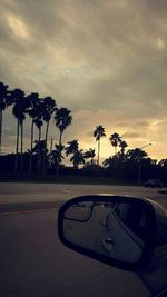 Road against cloudy sky at sunset