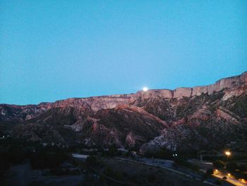 Scenic view of mountains against clear blue sky