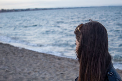 Rear view of woman at beach