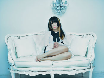 Young woman sitting on chair