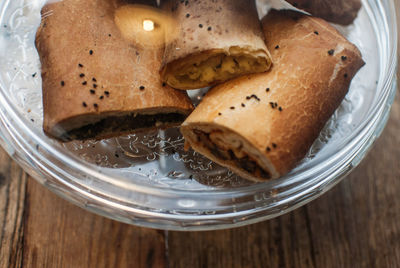 Close-up of sweet food served in glass bowl on wooden table