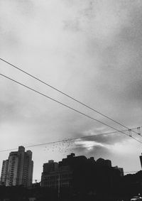 Low angle view of buildings in city against sky