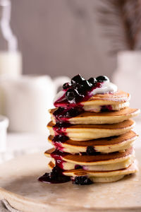 Freshly baked pancakes with berry jam for breakfast