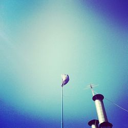 Low angle view of lamp post against blue sky