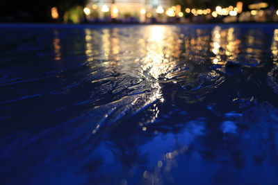 Reflection of illuminated water in lake
