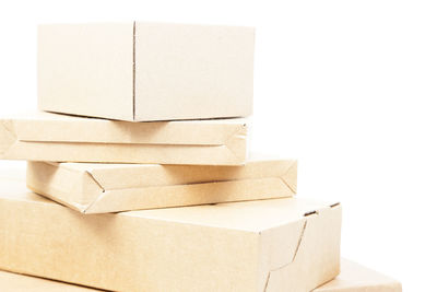 Close-up of boxes over white background