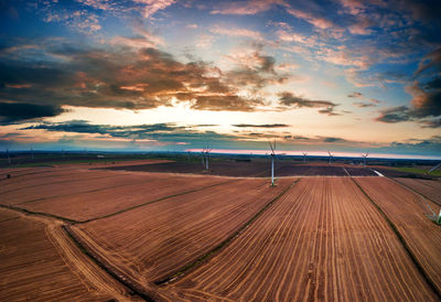 Scenic view of beach against sky during sunset
