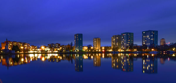 Reflection of illuminated buildings in water