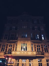 Low angle view of illuminated building at night