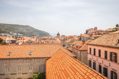 High angle view of buildings in city against sky