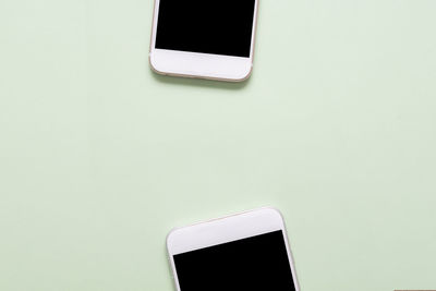 Close-up of smart phone against white background