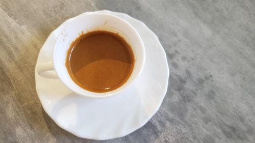 High angle view of coffee cup on table