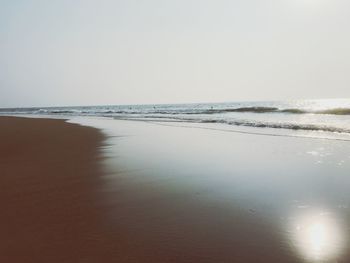 Scenic view of beach against clear sky