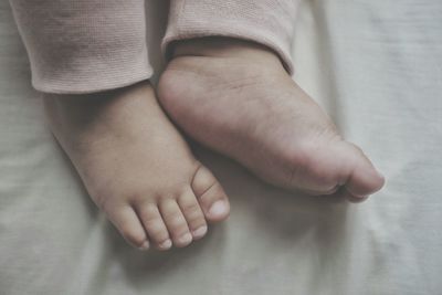 Low section of baby feet