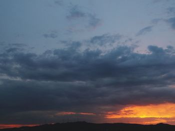 Low angle view of dramatic sky during sunset