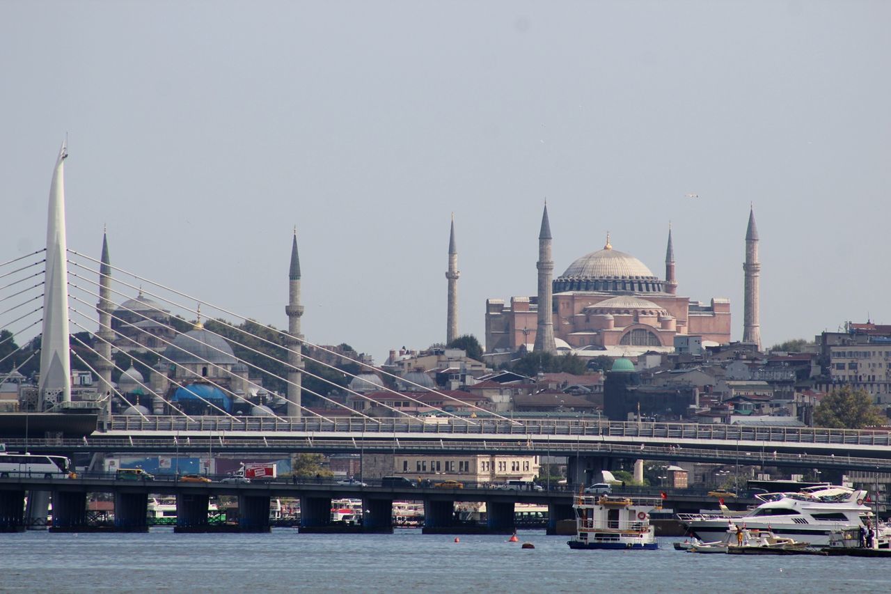 architecture, built structure, building exterior, sky, travel destinations, travel, tourism, city, water, transportation, building, religion, place of worship, bridge, belief, river, bridge - man made structure, no people, outdoors, cityscape, government, skyscraper