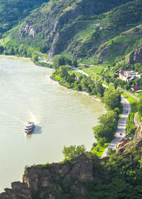 High angle view of river amidst mountains