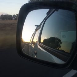 Cropped image of car on road