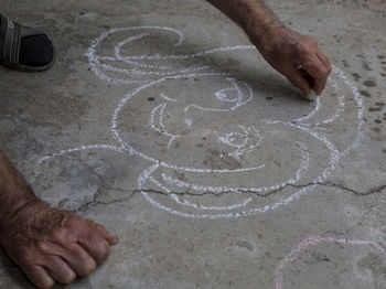 Close-up of hand holding painting