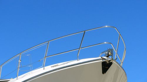 Cropped view of boat against blue sky