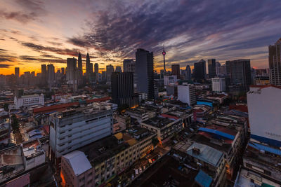 High angle view of buildings against sky during sunset