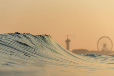 Scenic view of desert against sky during sunset