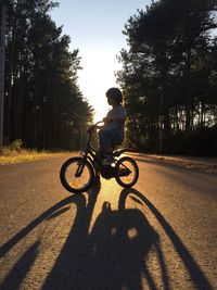 Man riding bicycle on road