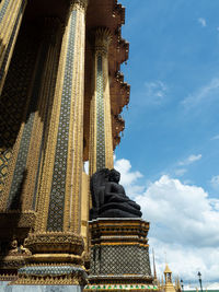 Low angle view of statue of building against sky