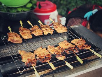 High angle view of meat on barbecue grill