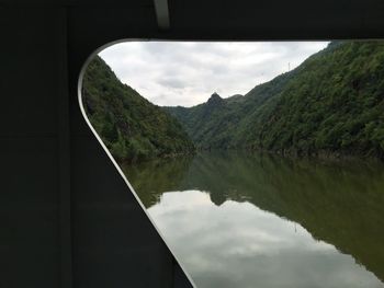 Scenic view of lake against cloudy sky